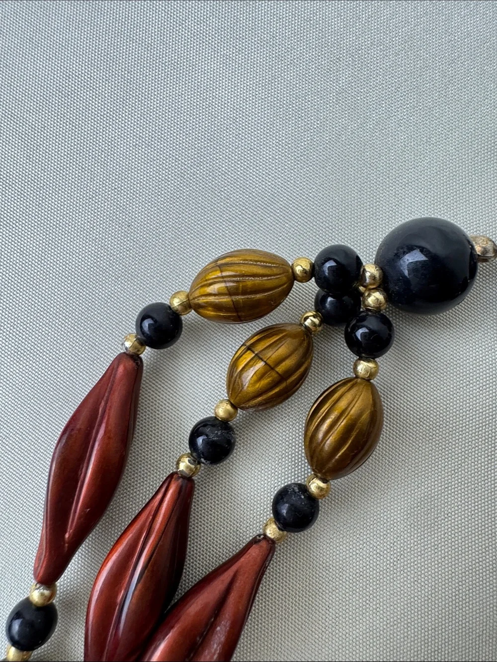 Multi-Strand Metallic Bead Necklace in Red, Gold & Black - Picture 6 of 10